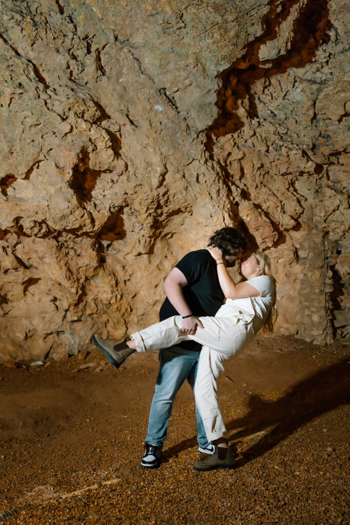 Couple gets engaged in a cave. Cave Springs, Georgia. 